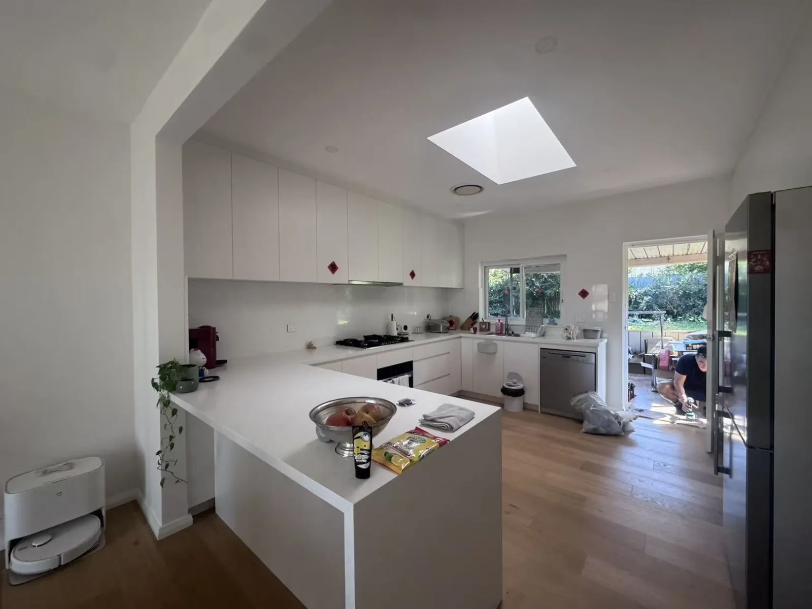 Completed Turramurra kitchen with white cabinetry and skylight